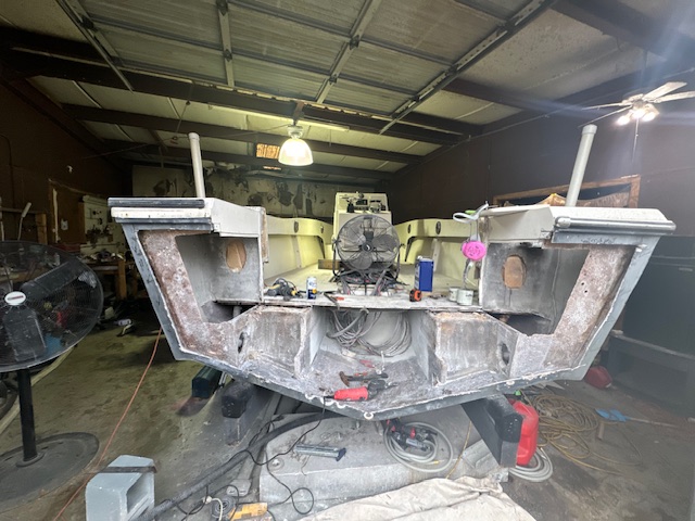 Boat transom stripped back to bare fiberglass during a rebuild